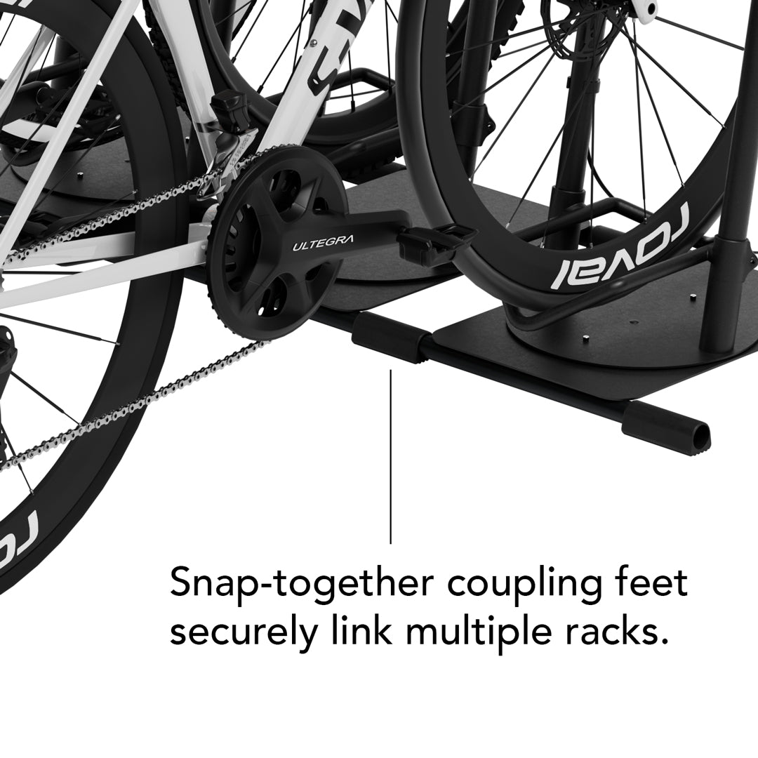 Close-up of two Ready Rack bases connected side by side via snap-together coupling feet, with text reading "Snap-together coupling feet securely link multiple racks."